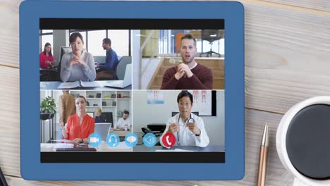 Animation-of-four-screens-with-doctors-and-professional-people-in-video-conference-on-digital-tablet