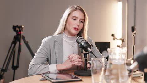 woman recording a podcast in a studio