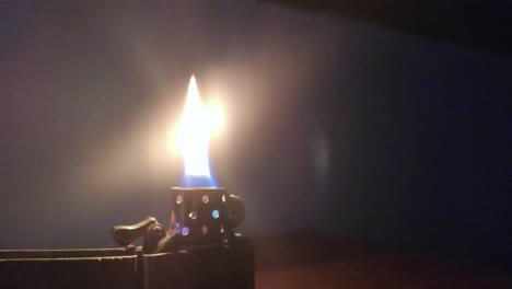 lighter flame at night on a table