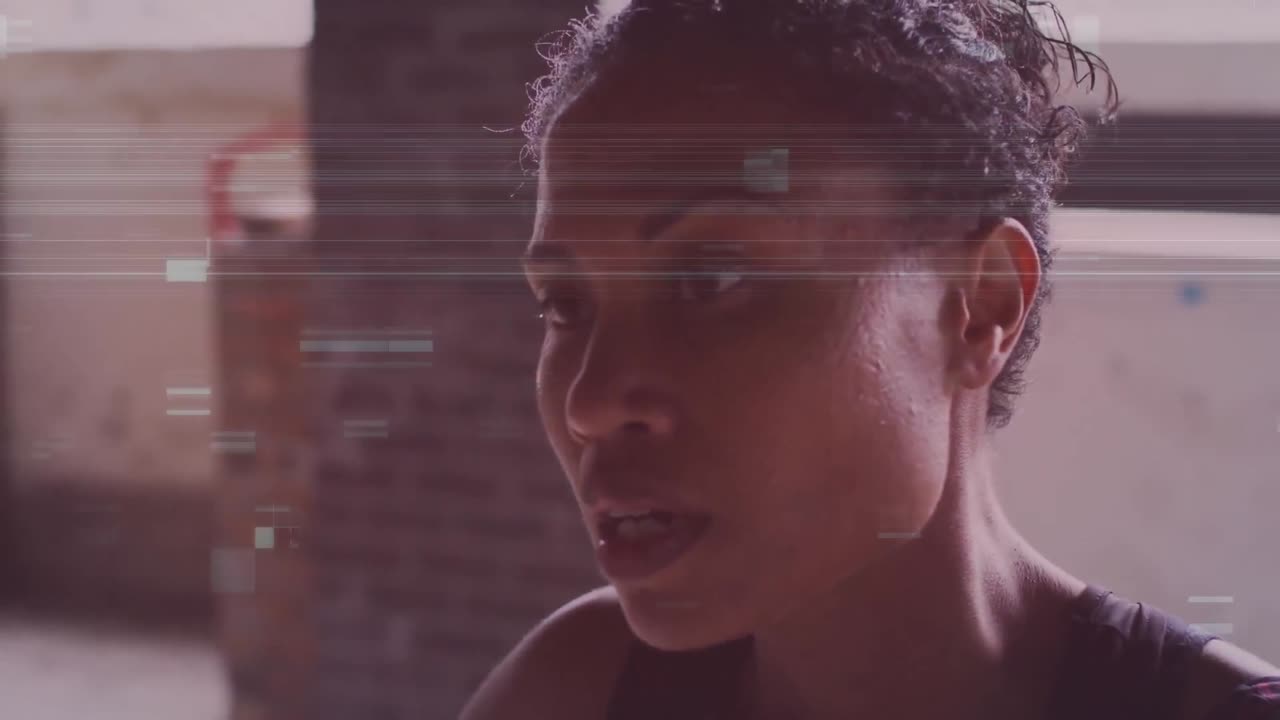 Animation of interference over african american sportswoman at gym