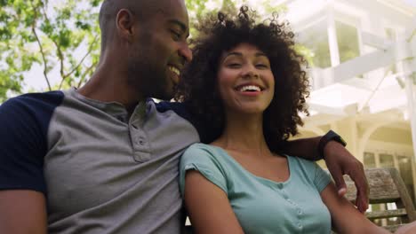 Happy-mixed-race-couple-enjoying-in-the-garden-during-a-sunny-day