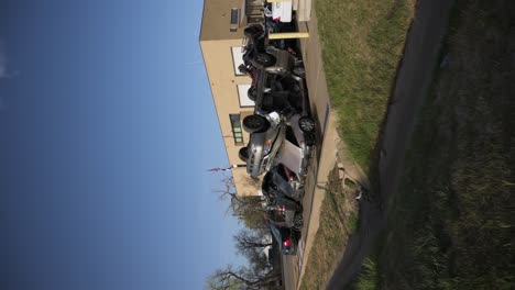 Wrecks-vehicles-used-to-train-firefighters-in-front-of-the-training-center,-vertical