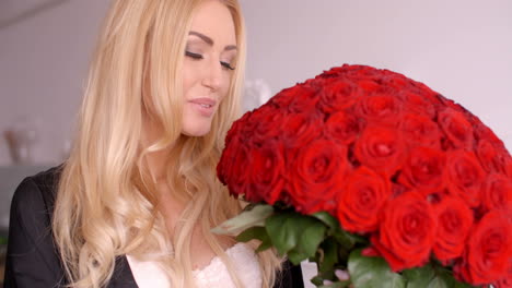 Happy-Woman-with-Fresh-Red-Rose-Flower-Bouquet