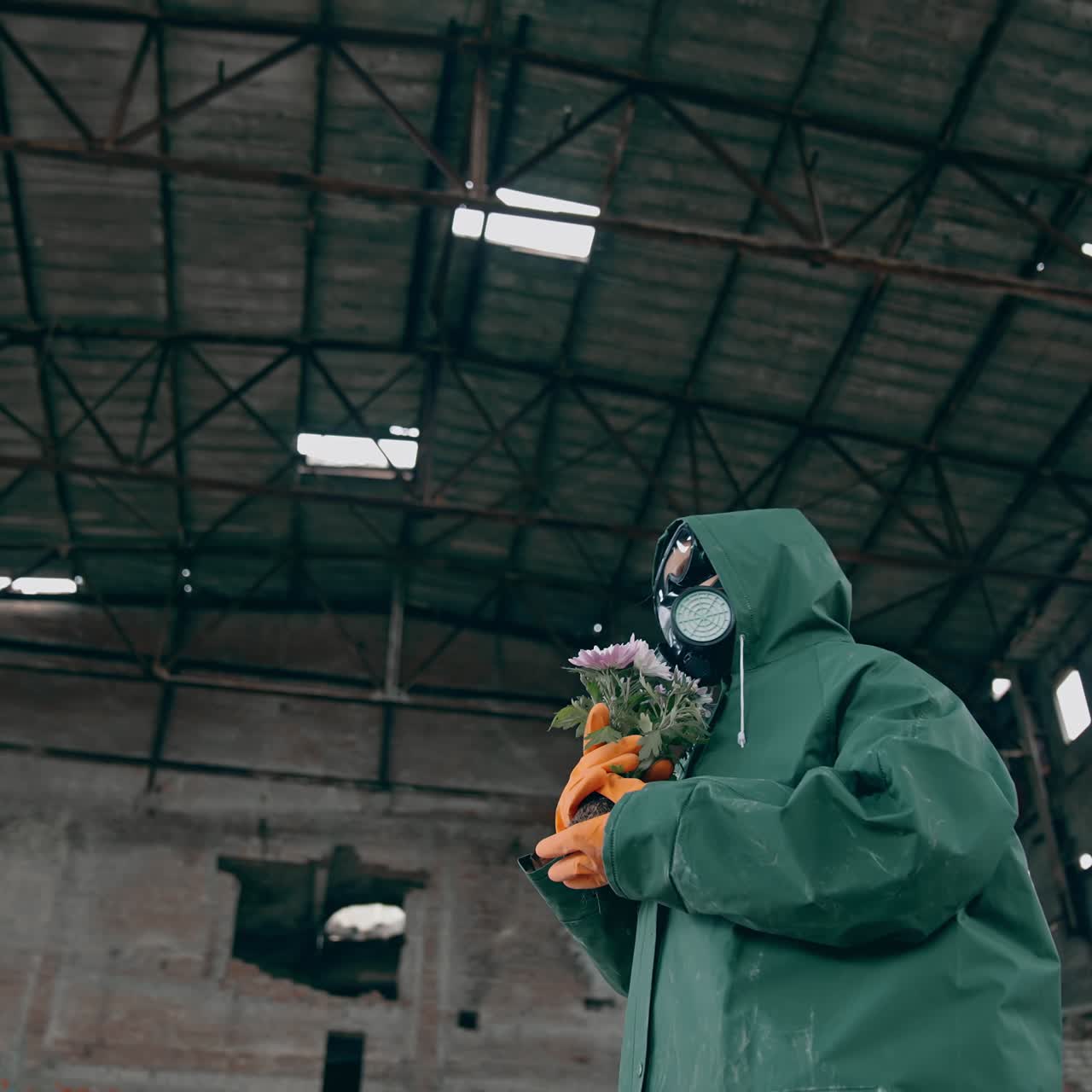 Man in ruined industrial building. Man wearing gas masks after nuclear disaster