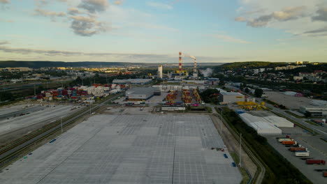 Aerial View Of Warehouse And Container Terminal In Gdynia, Poland With Industrial Plant In Background