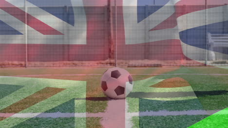 great britain flag waving against male soccer player with prosthetic leg kicking the soccer ball