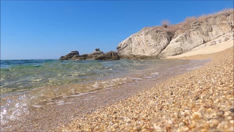 waves hitting on a greek beach