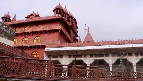 ancient-artistic-red-stone-holy-jain-temple-at-morning-video-is-taken-at-Soni-Ji-Ki-Nasiya-Jain-Temple,-Ajmer,-Rajasthan,-India