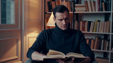 man reading in a cozy library setting