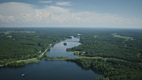 wide aerial hyperlapse of hyco lake with boats speeding to and fro