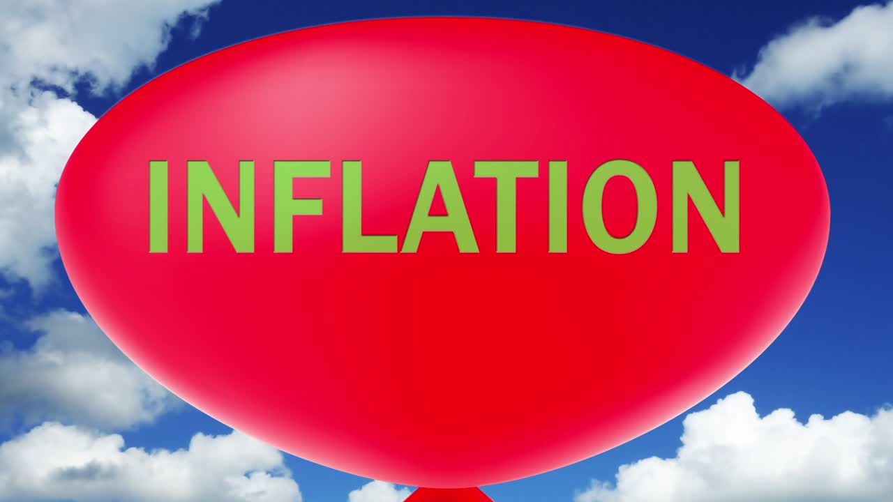 inflation concept.a red balloon with the text inflation inflates until it explodes