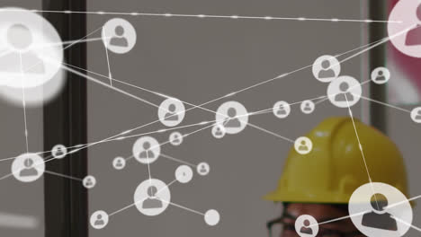 animation of network of connections over diverse people in warehouse