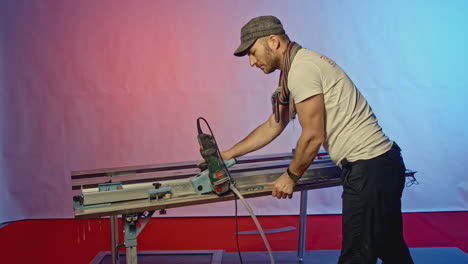 worker operating a cutting machine