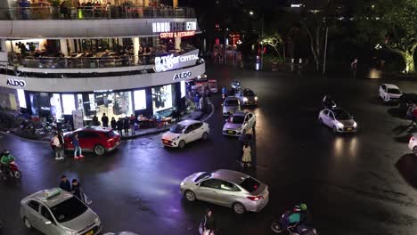 vehicles and pedestrians navigating busy intersection