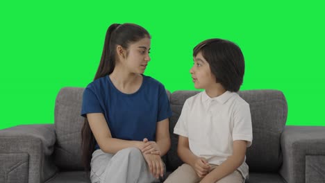 Indian-sibling-talking-and-sharing-things-Green-screen