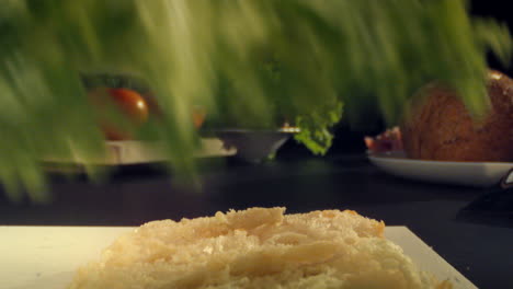 Detail-shot-preparing-sandwich,-lettuce