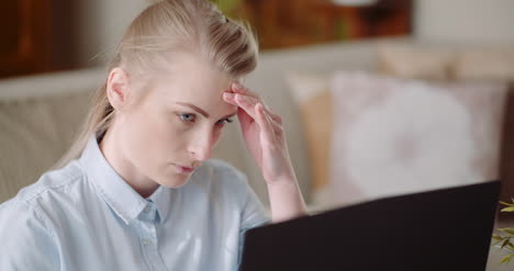 Beautiful-Thoughtful-Concerned-Woman-Working-On-Laptop-3