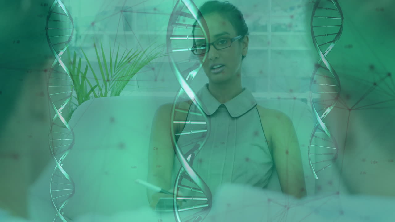 DNA strand animation over woman working on couch in modern office