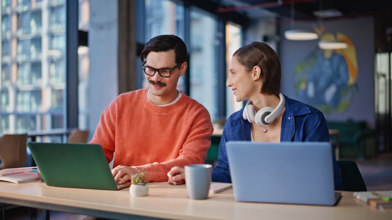 Friendly team discussing task at office open space closeup. Smiling man woman