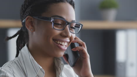 woman talking on phone in office