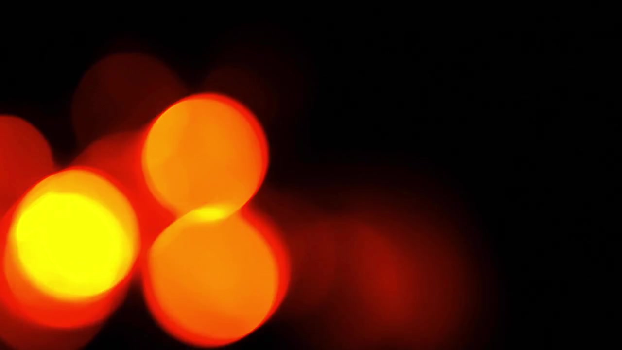 Abstrakt baggrund af glødende røde og gule bokeh-lys