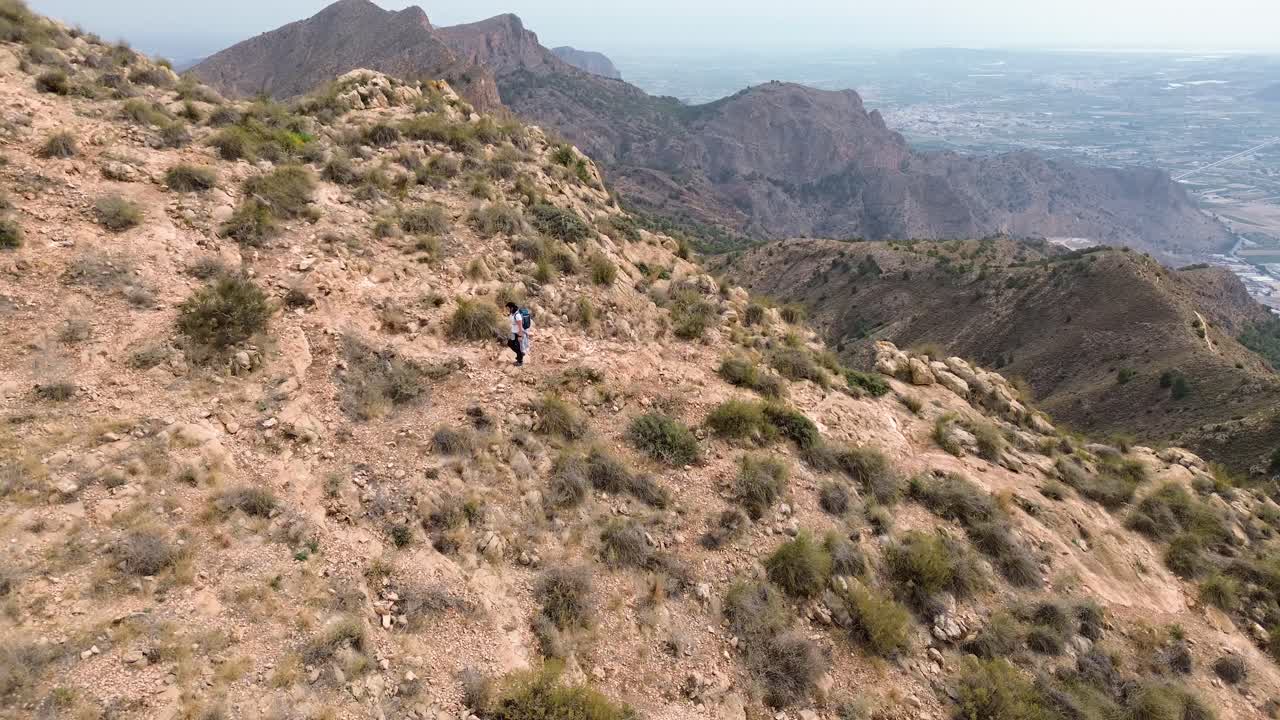 Hikers group walk along a rout in the mountain