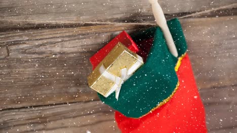 Falling-snow-with-Christmas-stocking