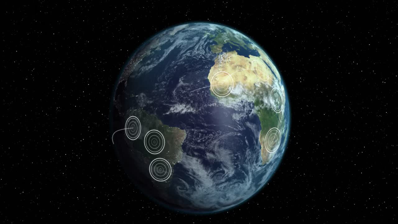 검은 바탕 에 있는 영토 들 사이 에 퍼져 있는 빛나는  ⁇ 색 동심 원 들 을 가진 회전 하는 지구