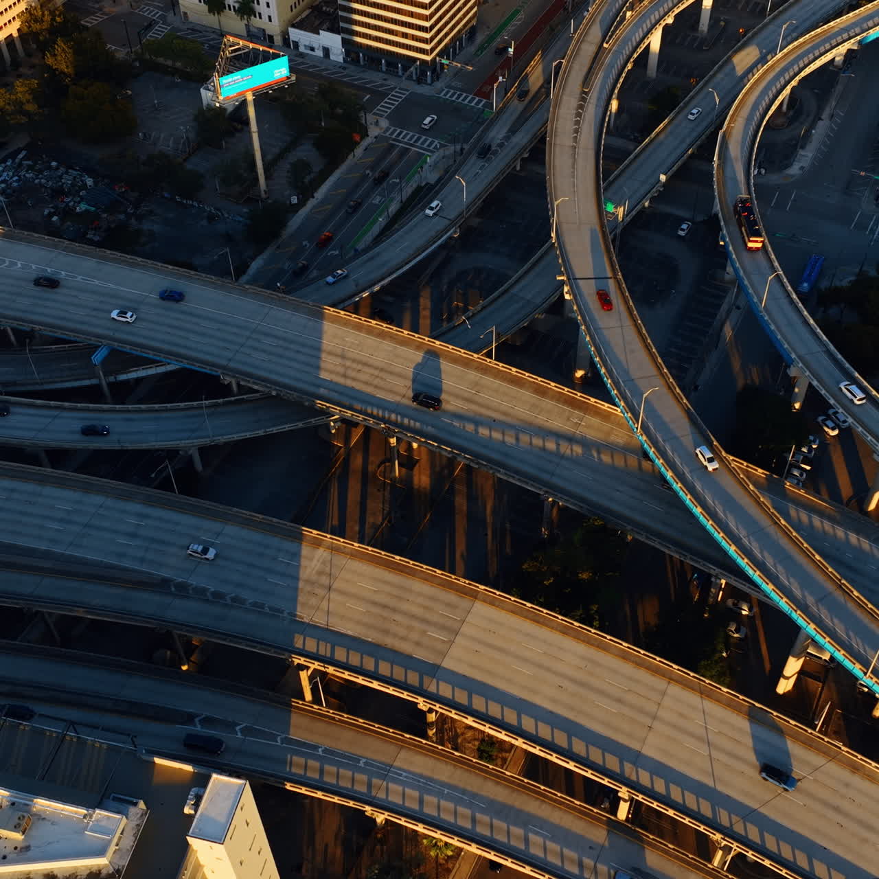 Cars riding by the freeways intertwining with each other. Top view on ...