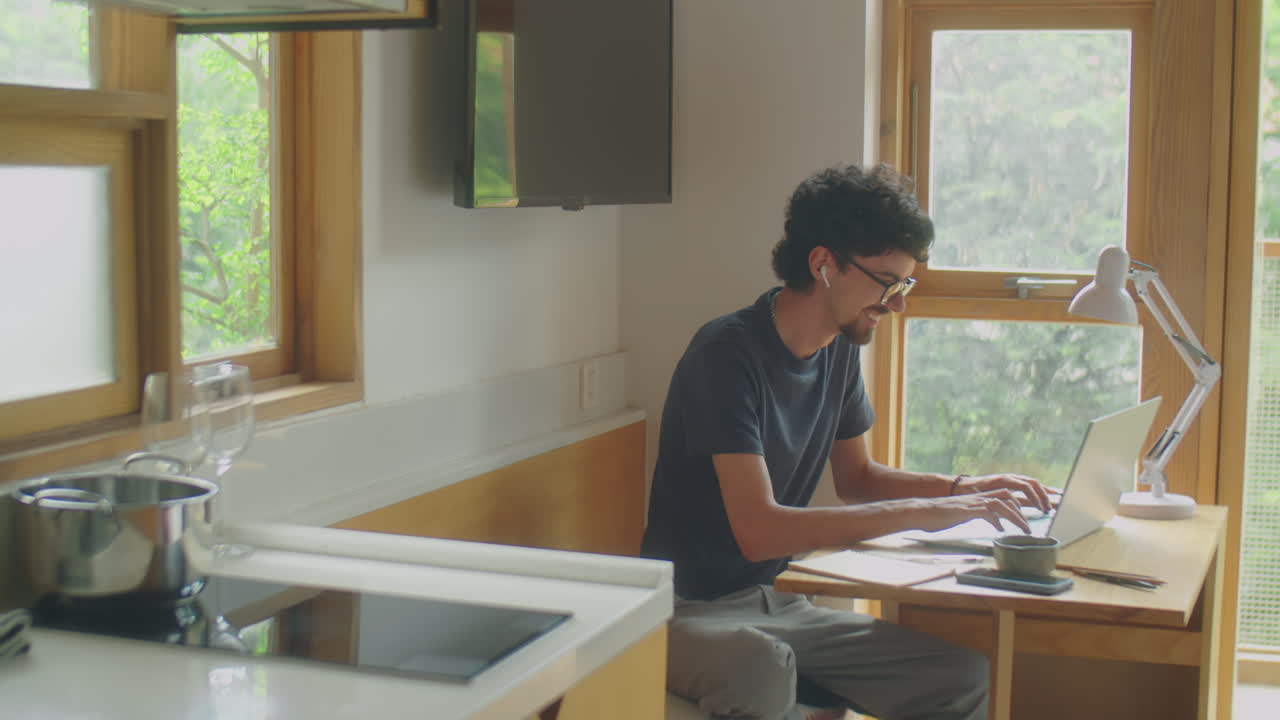Man Working on Laptop from Home