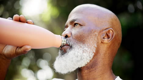 senior man staying hydrated with a water bottle outdoors