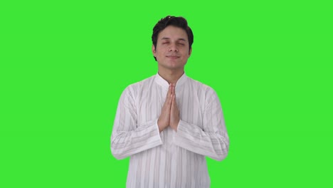 religious indian man praying to god green screen