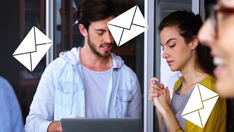 man discussing with his coworker while holding a laptop 4k