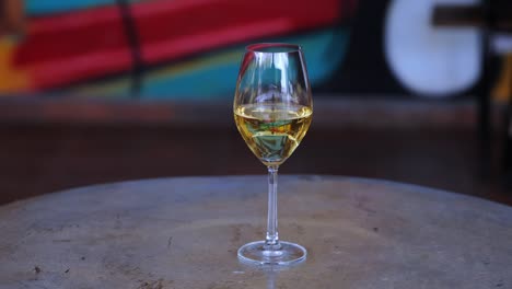 Glass-Of-White-Wine-On-The-Table.-closeup