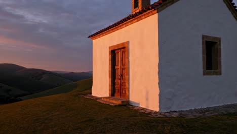 small chapel at sunrise on a mountaintop