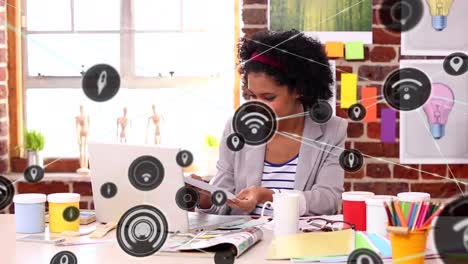 animation of network of digital icons against portrait of happy african american woman smiling