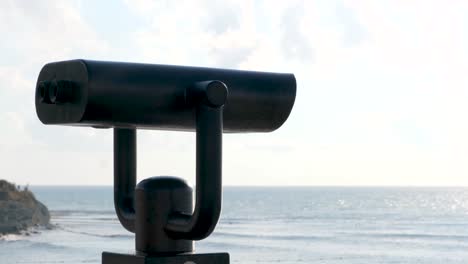 black binoculars at the coast