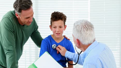 Male-doctor-examining-a-boy