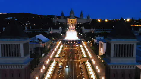 Aerial-view-of-venetian-tower-and-Monjuic-fountains,-Barcelona,-Spain