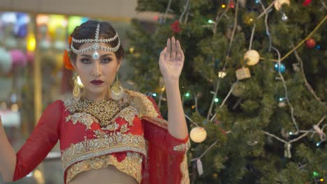 Stunning-and-beautiful-Indian-bride-poses-outside-in-the-city-at-night-wearing-traditional-Lehenga-dress-and-jewelry