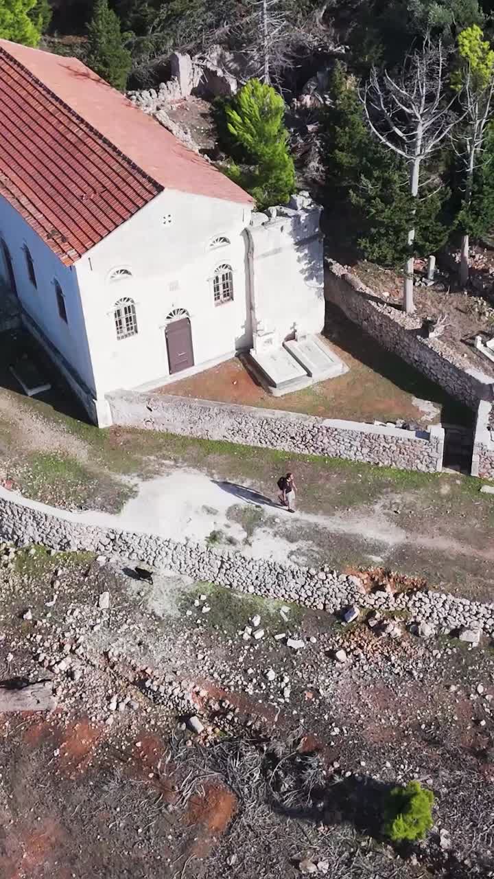 Aerial view of an old church and graveyard in a historical site