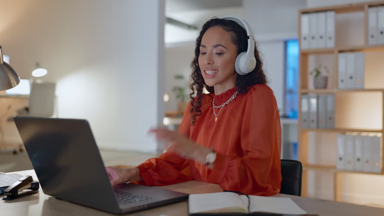 Happy woman with laptop, headphones