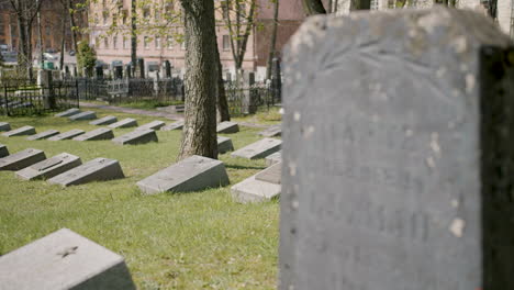 graveyard with tombstones in an urban area on a sunny day 1