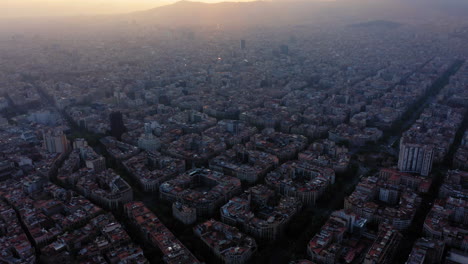 barcelona cityscape aerial view at sunset with clouds, spain