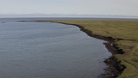 Aerial-Drone-Shot-Flying-Low-over-Melting-Permafrost-Eroding-into-the-Arctic-Ocean-from-Global-Warming-near-Barrow-Alaska