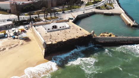 Top-view-of-Fort-of-Ponta-da-Bandeira-in-Lagos,-Algarve,-Portugal---Aerial-slow-Orbit