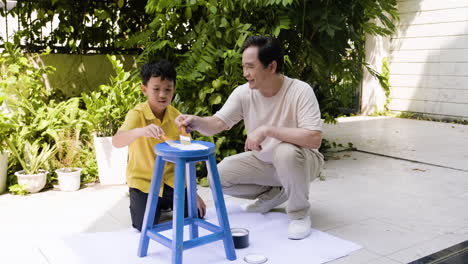 asian man and boy in the backyard