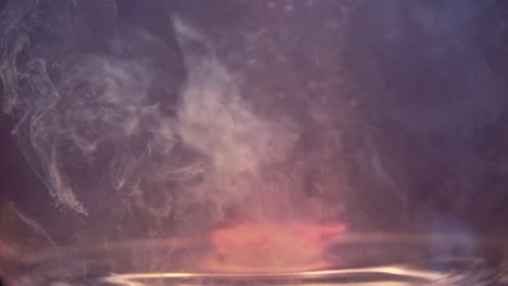 slowmotion shot of efervescent pill dissolving in water. bubbles going up. stable shot with the sony a7iii