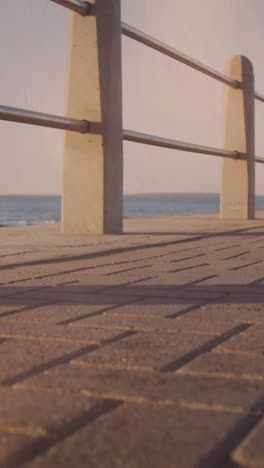 spots of light against african american fit woman running on the promenade