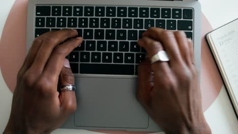 person typing on laptop